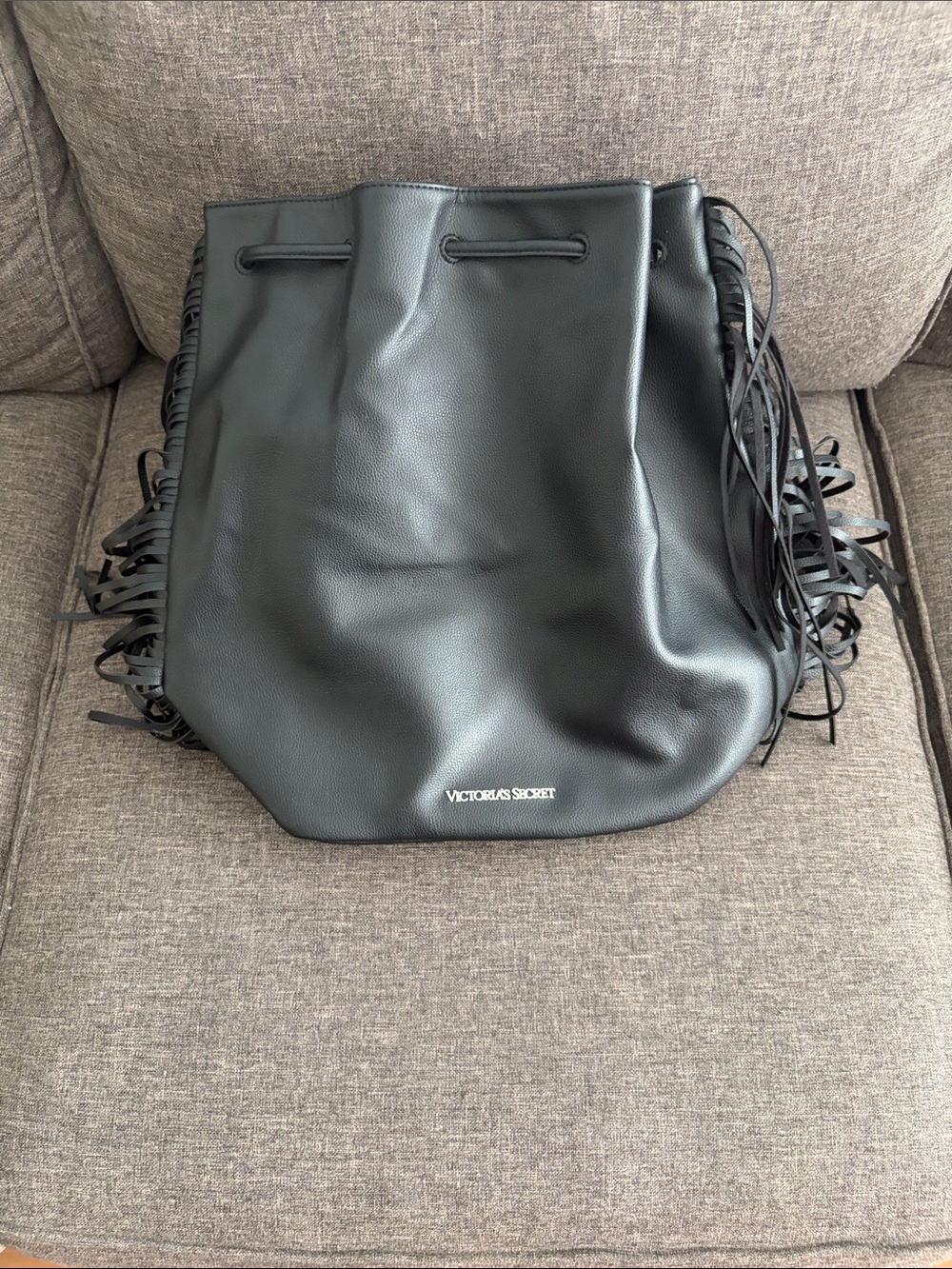 Victoria's Secret Black Fringe Drawstring backpack.